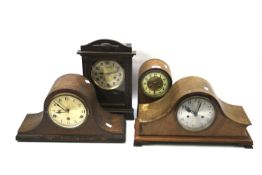 Four early 20th century wooden cased mantel clocks.