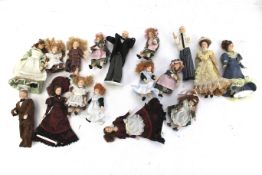 An assortment of dolls house dolls.