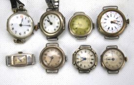 Eight vintage silver and silver plate watch faces.