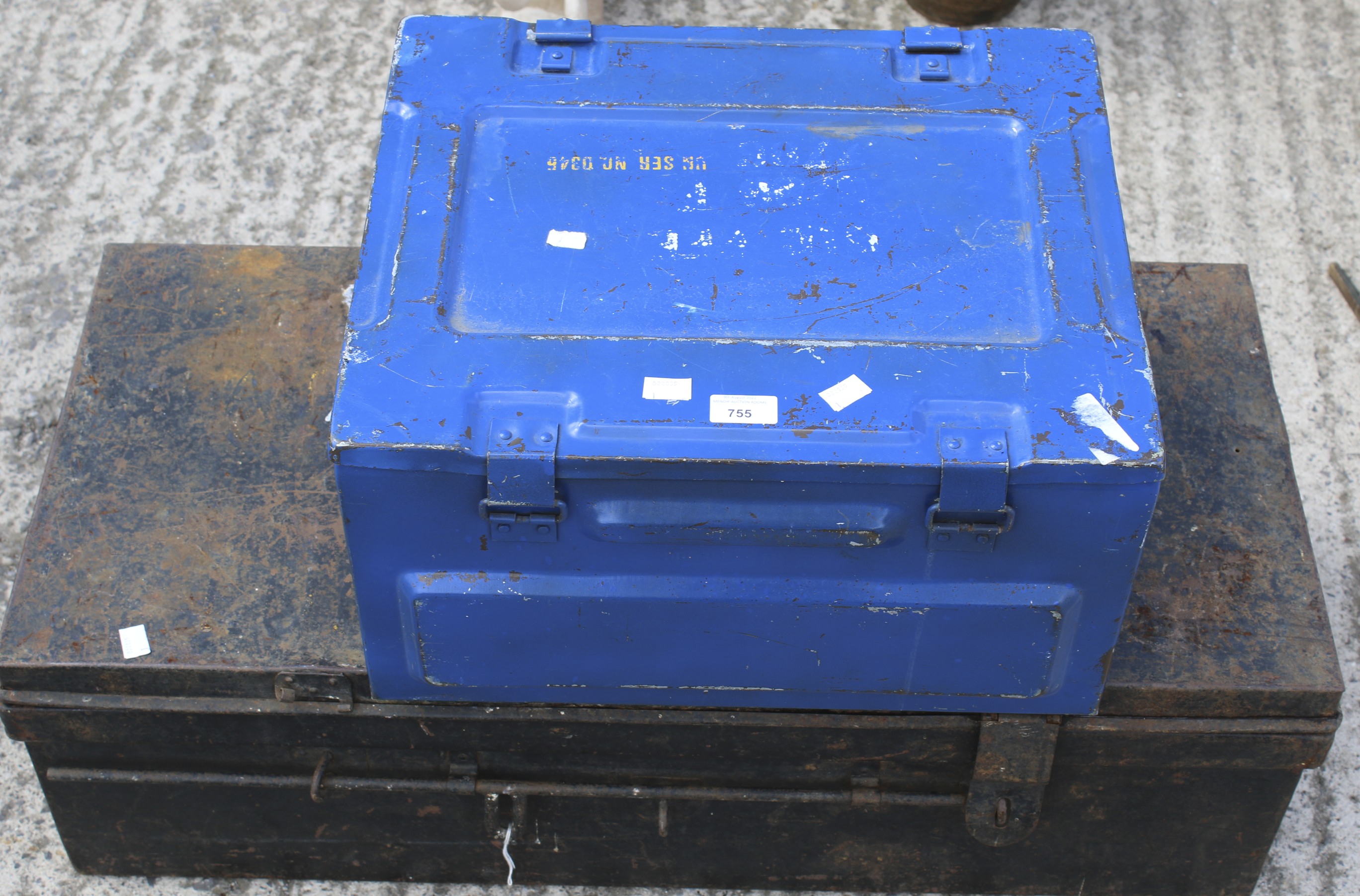 A military storage trunk and an ammunitions case.