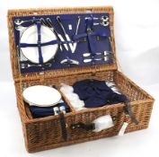 A Fortnum & Mason wicker picnic basket with fitted interior.
