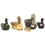A collection of duck and elephant figures.