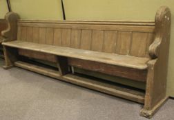 A 19th century pine church pew.