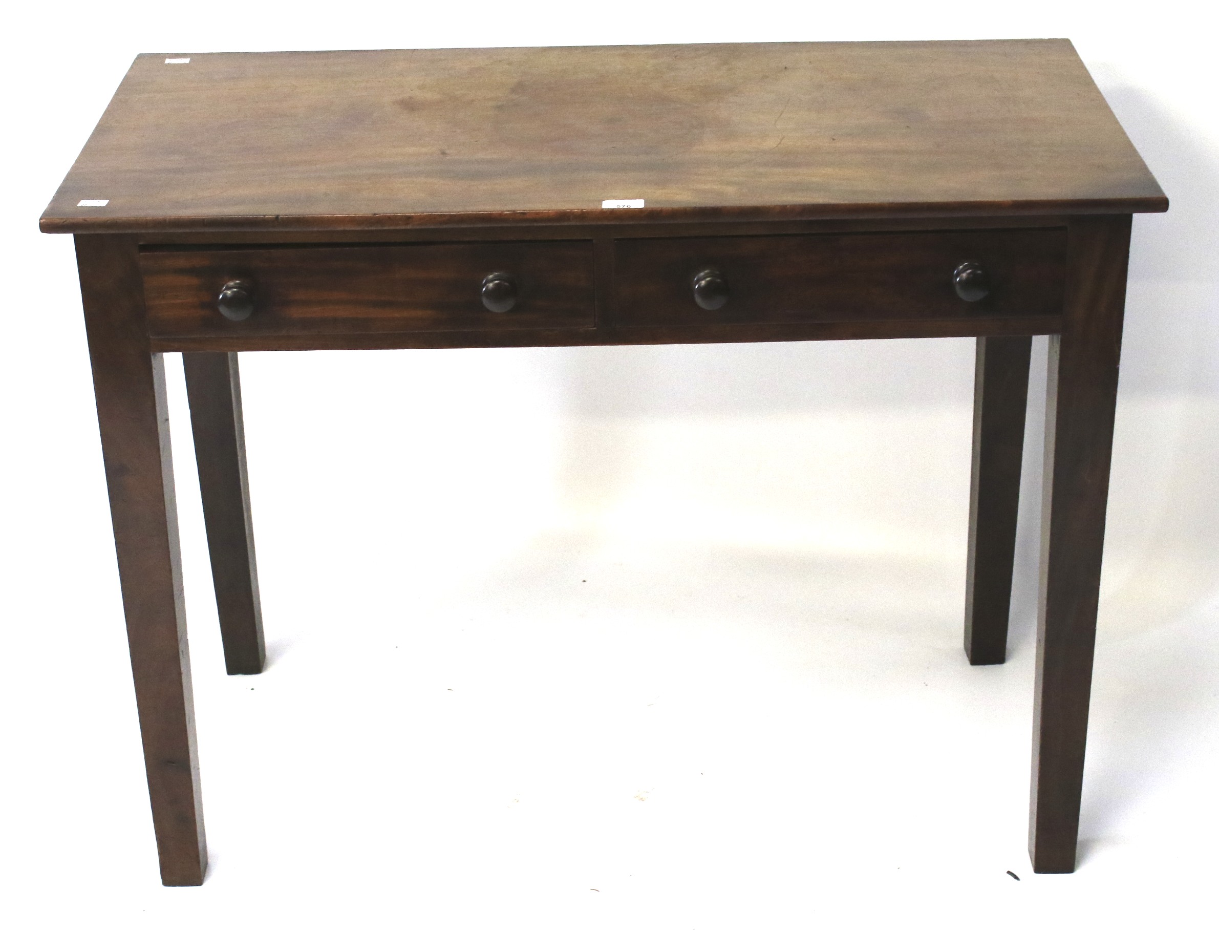 A Georgian mahogany two drawer desk/side table.