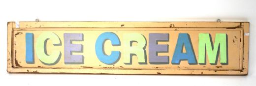 A vintage wooden 'Ice Cream' advertising sign.