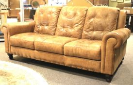 A large leather three seat sofa.