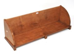 A 20th century stained wooden book trough.