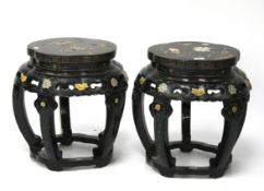 A pair of lacquered Chinese side tables.