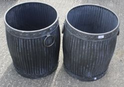 A pair of galvanized metal garden bins.