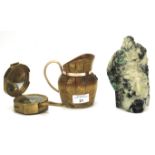 A 20th century compass, wooden jug and stone figure.