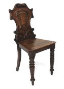 A Victorian mahogany hall chair.