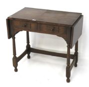 An oak drop flap two drawer side table.