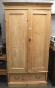 A late 19th century pine wardrobe.