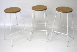 Three contemporary bar stools.