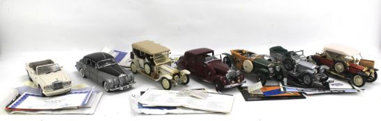 Seven Franklin Mint 1:24 scale Rolls Royce models.