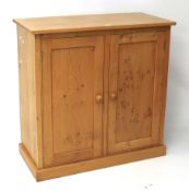 A contemporary burr oak cupboard.