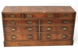 A 1970s mahogany large campaign chest of drawers.