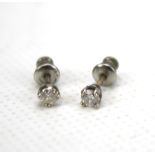 A pair of 9ct gold diamond stud earrings. Approximately 0.