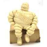 A resin model of a Michelin Man advertising figure.