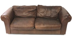 A brown leather three seater sofa.