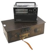 A metal storage box and a Bush multi band mains operated radio.