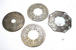 Three silver and glass mounted coasters and a similar plated example.