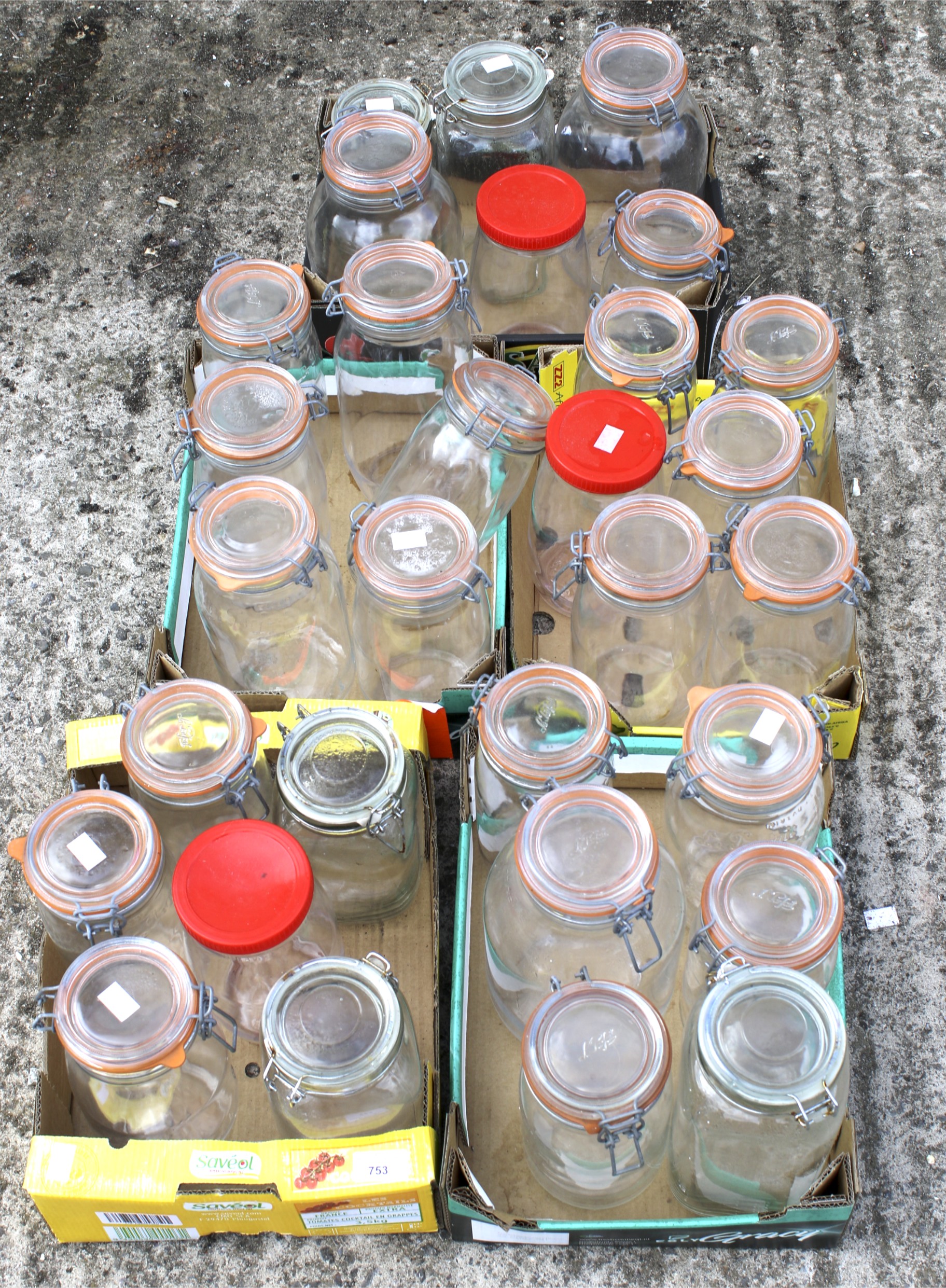 Thirty glass storage jars.