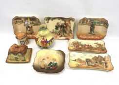 An assortment of Royal Doulton pictorial collectors' plates/bowls.