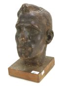 A bronzed plaster sculpture bust of a man.