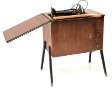 A 1960s century Singer sewing machine and stand.