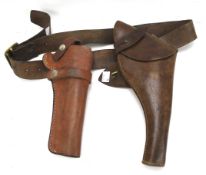 Two leather gun holsters and another pouch.