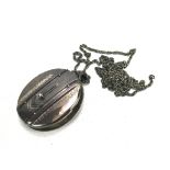 A late Victorian silver photo locket on chain.