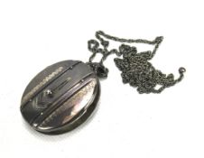 A late Victorian silver photo locket on chain.