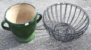 A pair of metal hanging baskets and a large ceramic jardiniere.