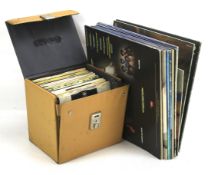 An assortment of vinyl records and albums.