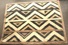 An Ethnic style woolen floor rug with geometric pattern,