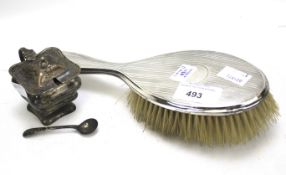 An Edwardian silver mustard pot with spoon and a silver mounted hairbrush.
