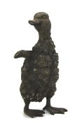 A bronze model of a 'fluffy duckling'.