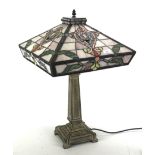 A Tiffany style coloured leaded glass table lamp.