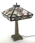 A Tiffany style coloured leaded glass table lamp.