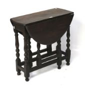 A 19th century oak drop leaf gate leg table.