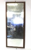 A mahogany framed 3/4 length wall mirror.