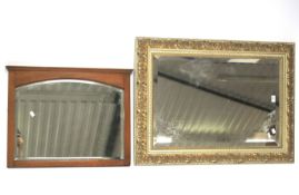 Two bevelled edge wall mirrors.