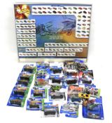 A collection of mostly boxed Hotwheels vehicles, together with a 2003 Hotwheels poster,