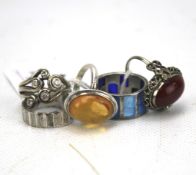 A selection of five silver rings. Three being gem set, approximately 23.