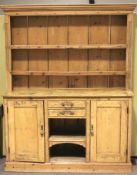 A 19th century pine kitchen dresser.