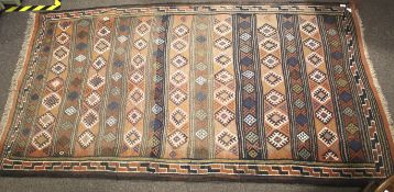 A 20th century woollen woven rug.