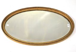 A 20th century bevelled edge wall mirror.