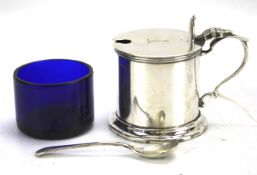 A hallmarked silver Asprey of London mustard pot and matching spoon.