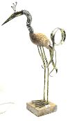 A contemporary metal sculpture in the form of a stylised crane.
